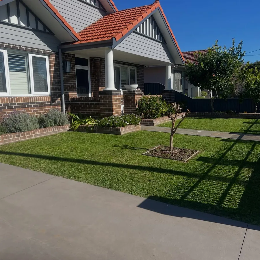 Front yard after mowing with the garden bed edged